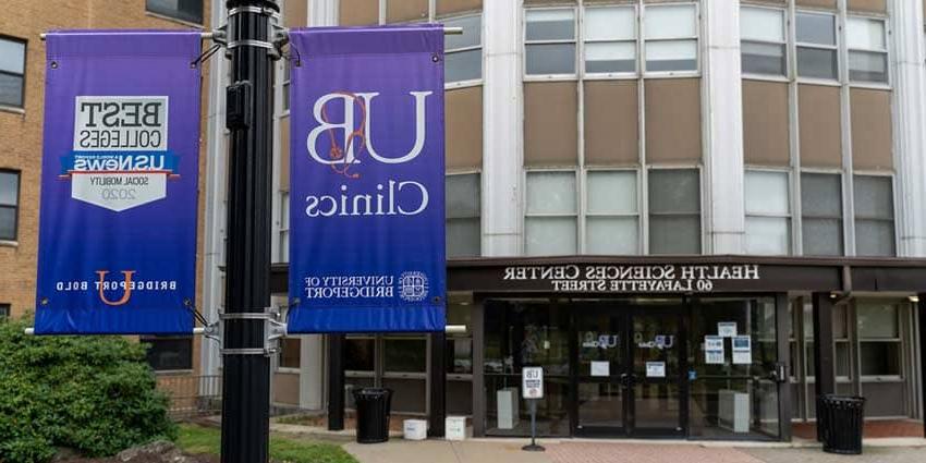 exterior of health sciences building showing UB clinics sign